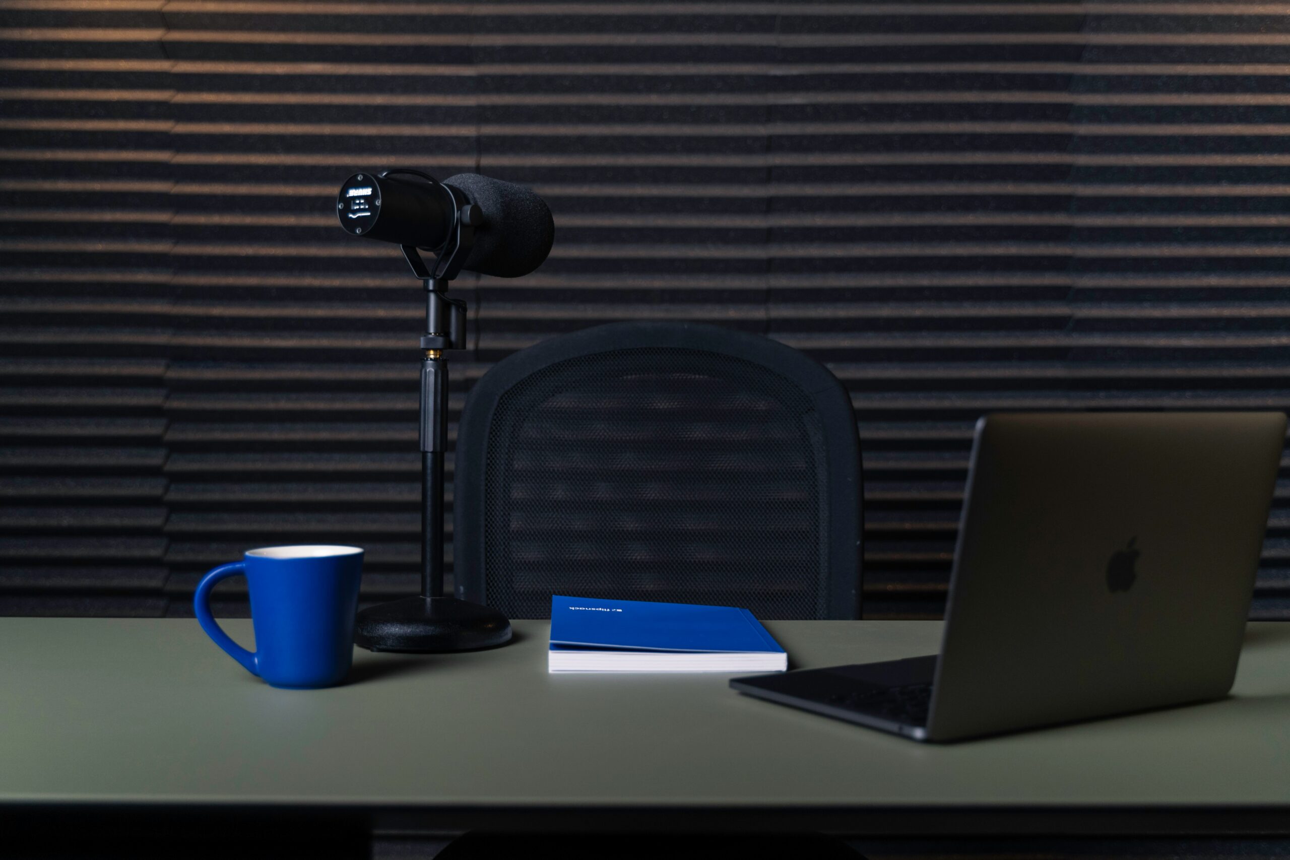 a laptop and a lamp on a table